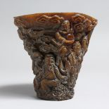 A CARVED HORN STYLE LIBATION CUP. 5ins high.