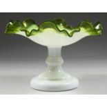 A ViCTORIAN OPAQUE AND TINTED GREEN GLASS FRILLY EDGE COMPORT, the central base stamped with