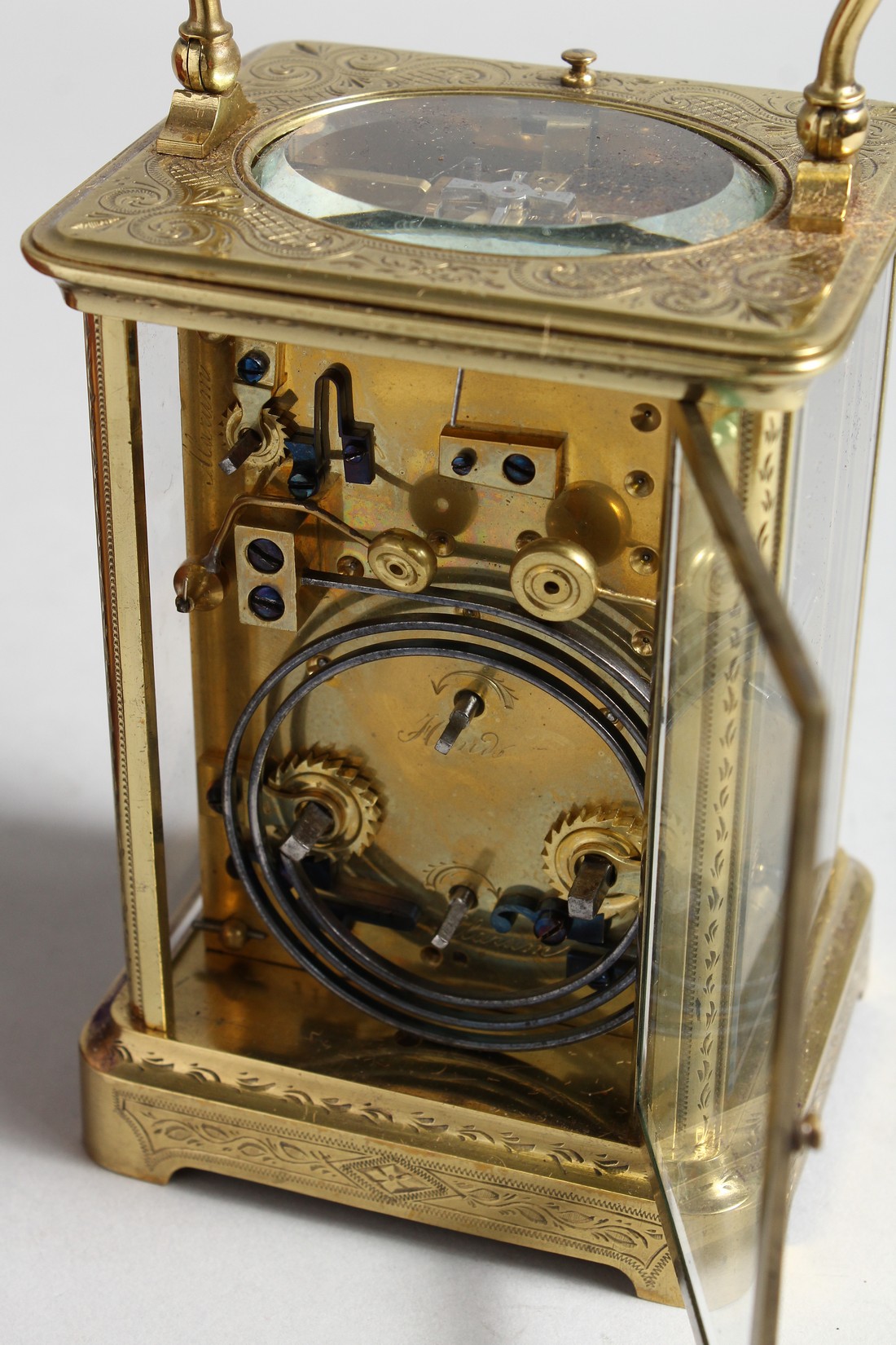 A GOOD FRENCH ENGRAVED BRASS CARRIAGE CLOCK with eight day movement, striking on a gong, enamel dial - Image 4 of 8