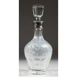 A VERY GOOD CUT GLASS DECANTER AND STOPPERS with fruiting vines and silver band.