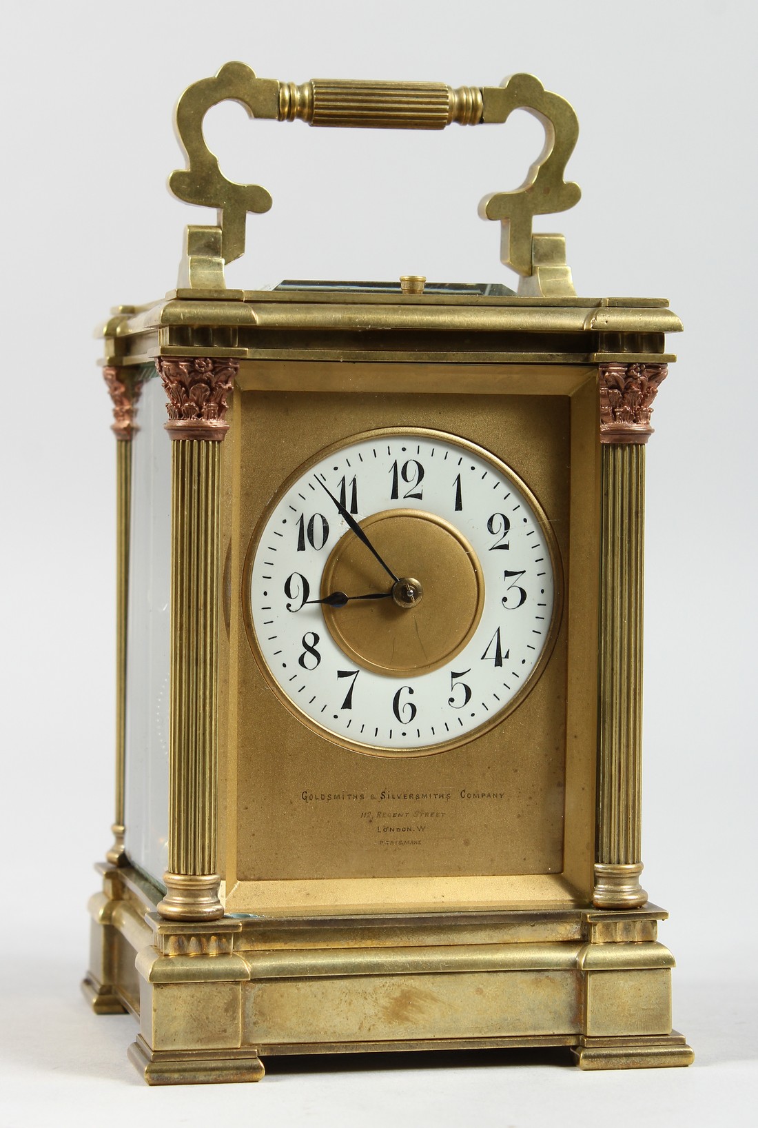 A GOOD GOLDSMITHS & SILVERSMITHS BRASS CARRIAGE CLOCK with repeat action and column supports. 6ins
