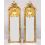 A LONG PAIR OF UPRIGHT GILT MIRRORS 5ft 9ins long x 1ft 8ins wide.