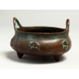 A SMALL CHINESE BRONZE CIRCULAR CENSER, the side with caligraphy. 8cm diameter.