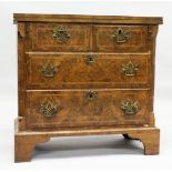 AN 18TH CENTURY WALNUT BATCHELOR'S CHEST with a crossbanded rectangular fold over top, two small