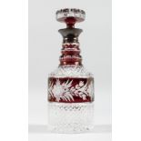 A VERY GOOD CUT GLASS PLAIN AND RUBY DECANTER AND STOPPER with silver band. 11ins high.