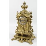 A 19TH CENTURY ORMOLU MANTLE CLOCK with eight day movement, striking on a bell, the dial with enamel