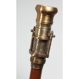 A NOVELTY WALKING STICK with COMBINATION COMPASS AND TELESCOPE HANDLE. 38.75ins long.