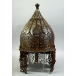 AN ISLAMIC INDO PERSIAN STEEL HELMET, engraved with calligraphy, with hanging neck guards and