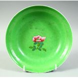 A 19TH CENTURY CHINESE GREEN GROUND FAMILLE ROSE PORCELAIN BOWL, the exterior with scrolling foliate