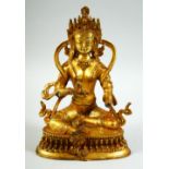 A GILT BRONZE MODEL OF A SEATED DEITY, 22.5cm high.