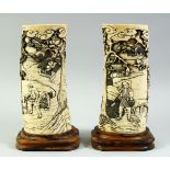 A PAIR OF JAPANESE MEIJI PERIOD CARVED IVORY TUSK VASES on fitted keyaki wood stands, circa 1890,