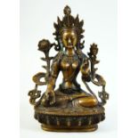 AN INDIAN BRONZE MODEL OF A SEATED DEITY, 21.5cm high.