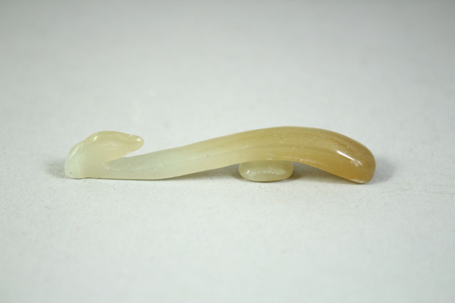 FOUR SMALL CHINESE CARVED JADE HOOKS, (4). - Image 2 of 5