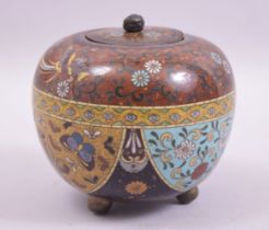 A JAPANESE CLOISONNE KORO AND COVER, decorated with panels of butterflies and flower heads beneath a