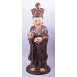 A LARGE CHINESE CARVED WOOD AND LACQUERED FIGURE, possibly 18th Century, 75cm high.