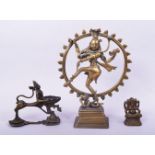 A 19TH CENTURY INDIAN BRASS SHIVA, 19.5cm high, together with two other brass figures (3).