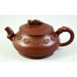 A CHINESE YIXING TEAPOT AND COVER, the inner lid and base with impressed marks, 16cm from handle
