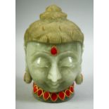 AN INDIAN CARVED JADE / GREEN HARDSTONE BUDDHA HEAD, onlaid with semi precious stones and gilt