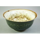 A CHINESE CELADON GLAZE PORCELAIN BOWL, the exterior with carved floral motifs, with painted blue