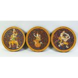 THREE THAI CIRCULAR PAINTINGS ON WOOD, painted with buddhist deities and figures, embellished with