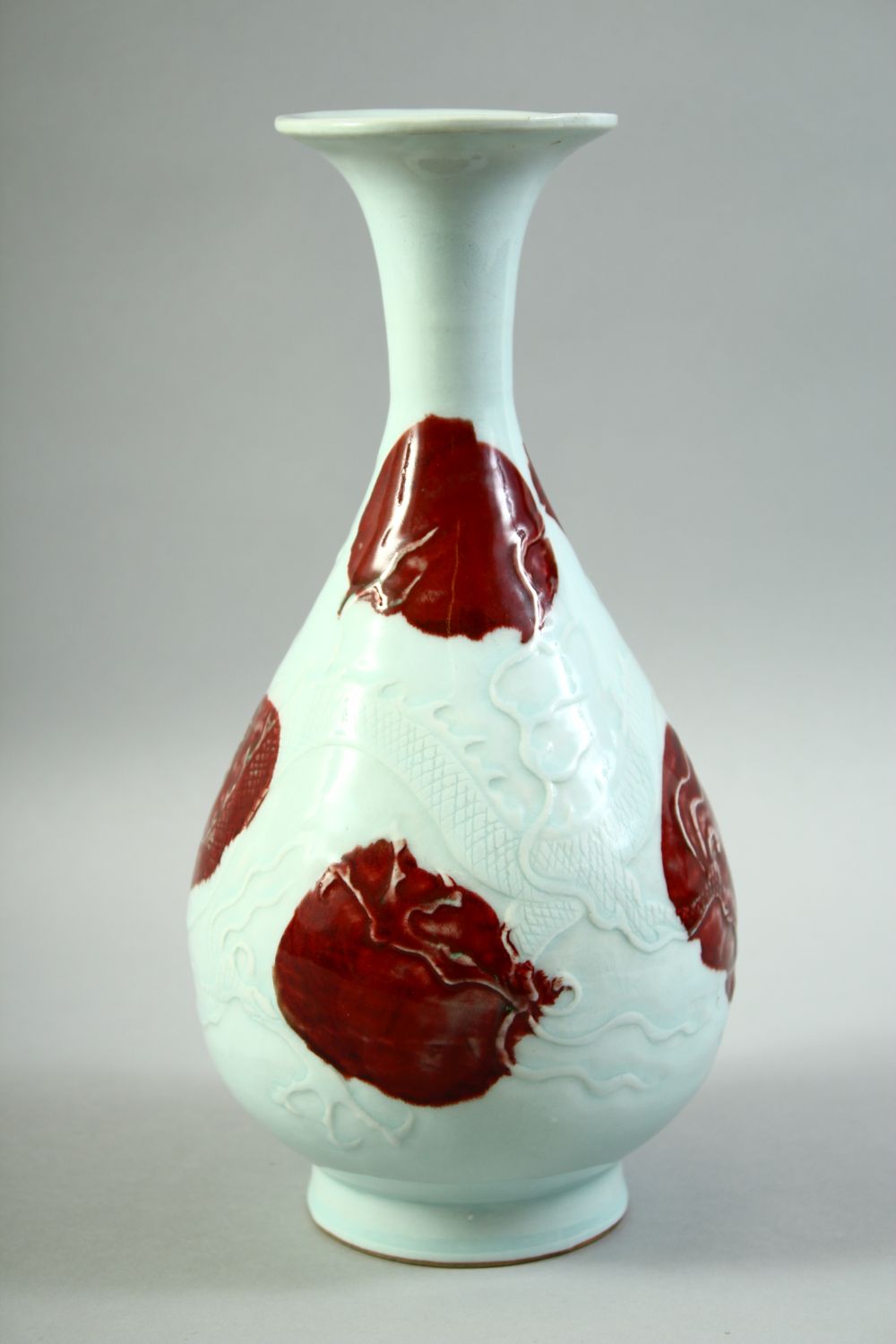 A CHINESE UNDER GLAZED RED AND WHITE DRAGON VASE, the body carved with a dragon and stylised flames, - Image 2 of 6