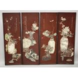 FOUR LARGE CHINESE CARVED AND STAINED WOODEN PANELS, depicting various flora, each with inscription