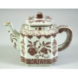 A CHINESE UNDERGLAZE RED TEAPOT, with floral decoration, six character mark to base, 17cm long.