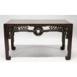 A VERY GOOD CHINESE RECTANGULAR LOW TABLE, POSSIBLY HUANGHUALI, with well carved pierced frieze,