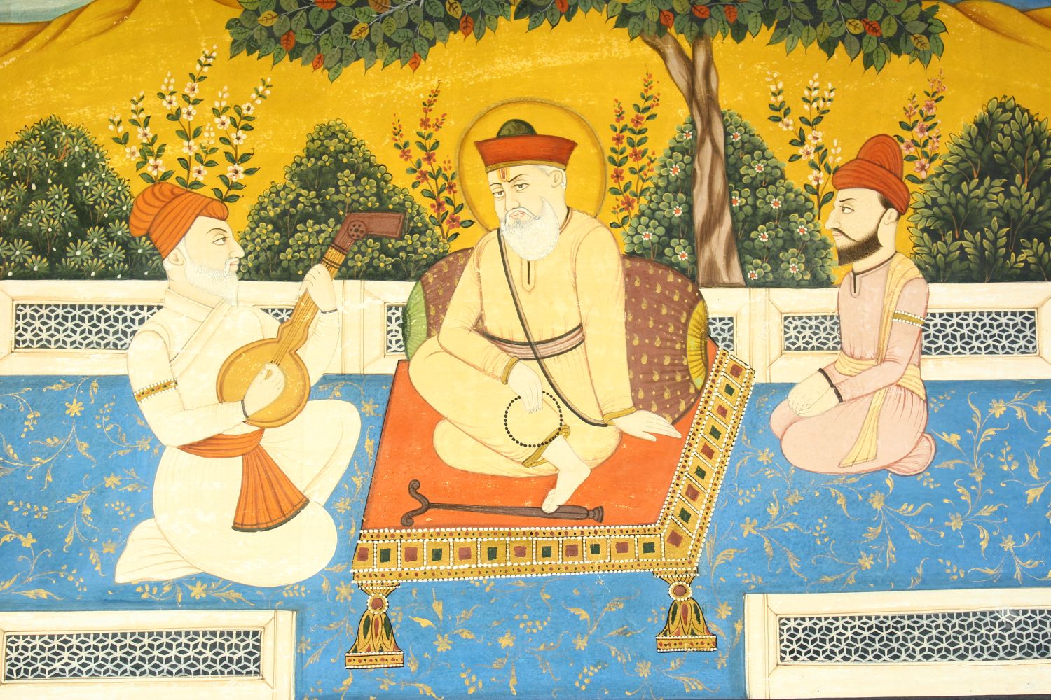 A LARGE INDIAN MINIATURE PAINTING ON PAPER, depicting a seated holy man with a musician and - Image 2 of 6