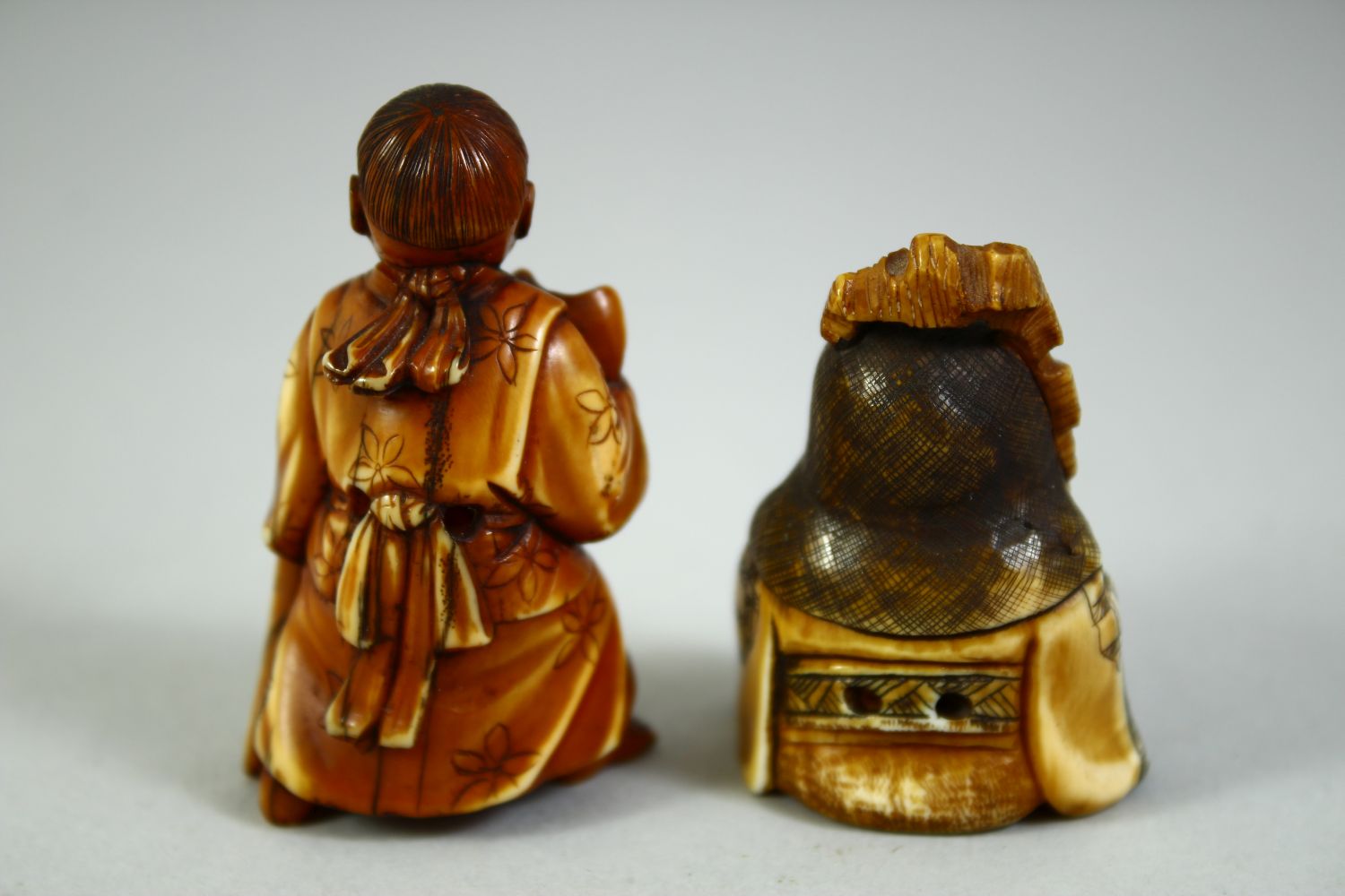 TWO CARVED NETSUKES, one of a boy holding a noh mask, the other of a sage, (2). - Image 3 of 7