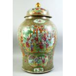 A VERY LARGE CHINESE CANTON FAMILLE ROSE PORCELAIN JAR AND COVER, decorated with multiple panels