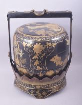 AN EARLY 20TH CENTURY LACQUERED WOOD JUBAKO / FOOD CARRIER, in black and gilt lacquer and