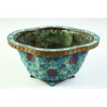 A CHINESE CLOISONNE QUATREFOIL SHAPE PLANTER, with cloisonne floral motif decoration and raised on