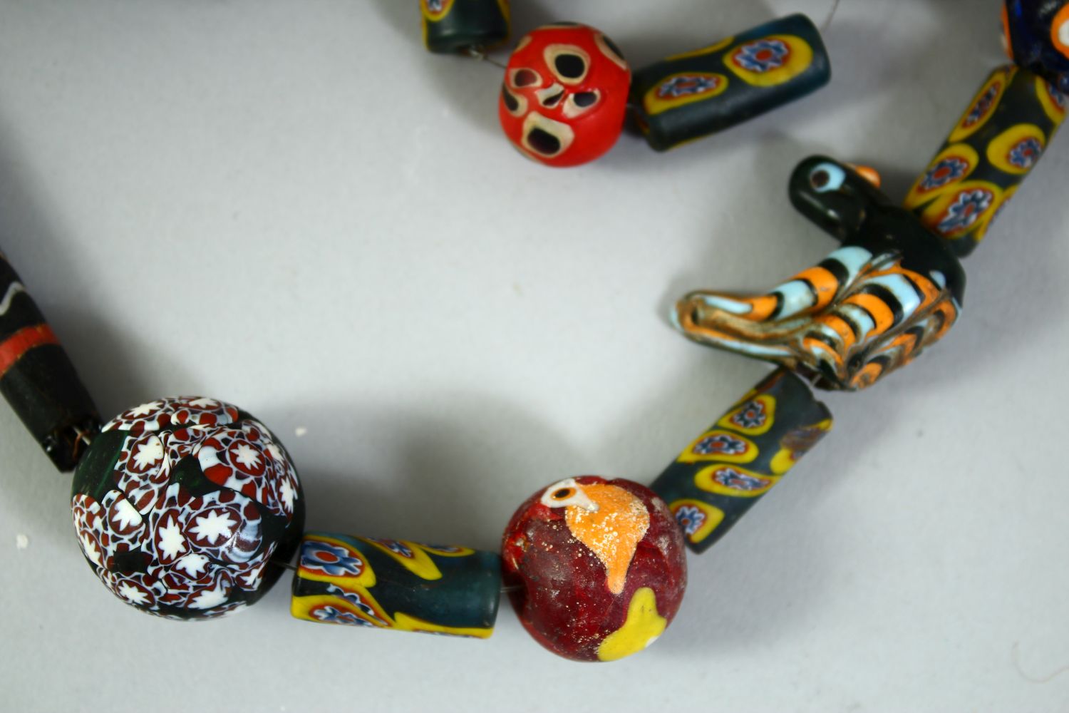 AN ISLAMIC GLASS BEADED NECKLACE, of different styles and sizes including two marvered glass - Image 5 of 5