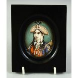 AN INDIAN MINIATURE OVAL PORTRAIT OF A FEMALE FIGURE on ivory, in an ebonised wood frame and glazed,