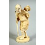 A JAPANESE CARVED IVORY OKIMONO, of a fisherman feeding a small fish to a bird upon his back, the