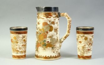 A PAIR OF SATSUMA PORCELAIN BEAKERS AND JUG, all with silver band rims, (one af).