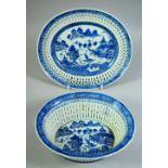 A CHINESE BLUE AND WHITE PORCELAIN OVAL BASKET AND STAND, basket 22.5cm wide.