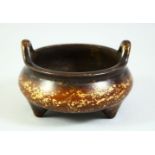 A CHINESE GOLD SPLASH BRONZE CENSER, with six character mark to base, 13cm diameter.