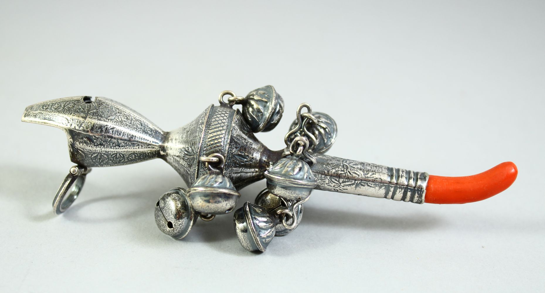 A CONTINENTAL SILVER AND CORAL NINE BELL RATTLE