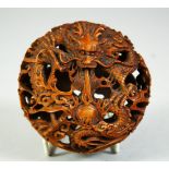 A SUPERB CHINESE PIERCED BOXWOOD CARVING, with intertwining dragons amongst clouds and bearing the