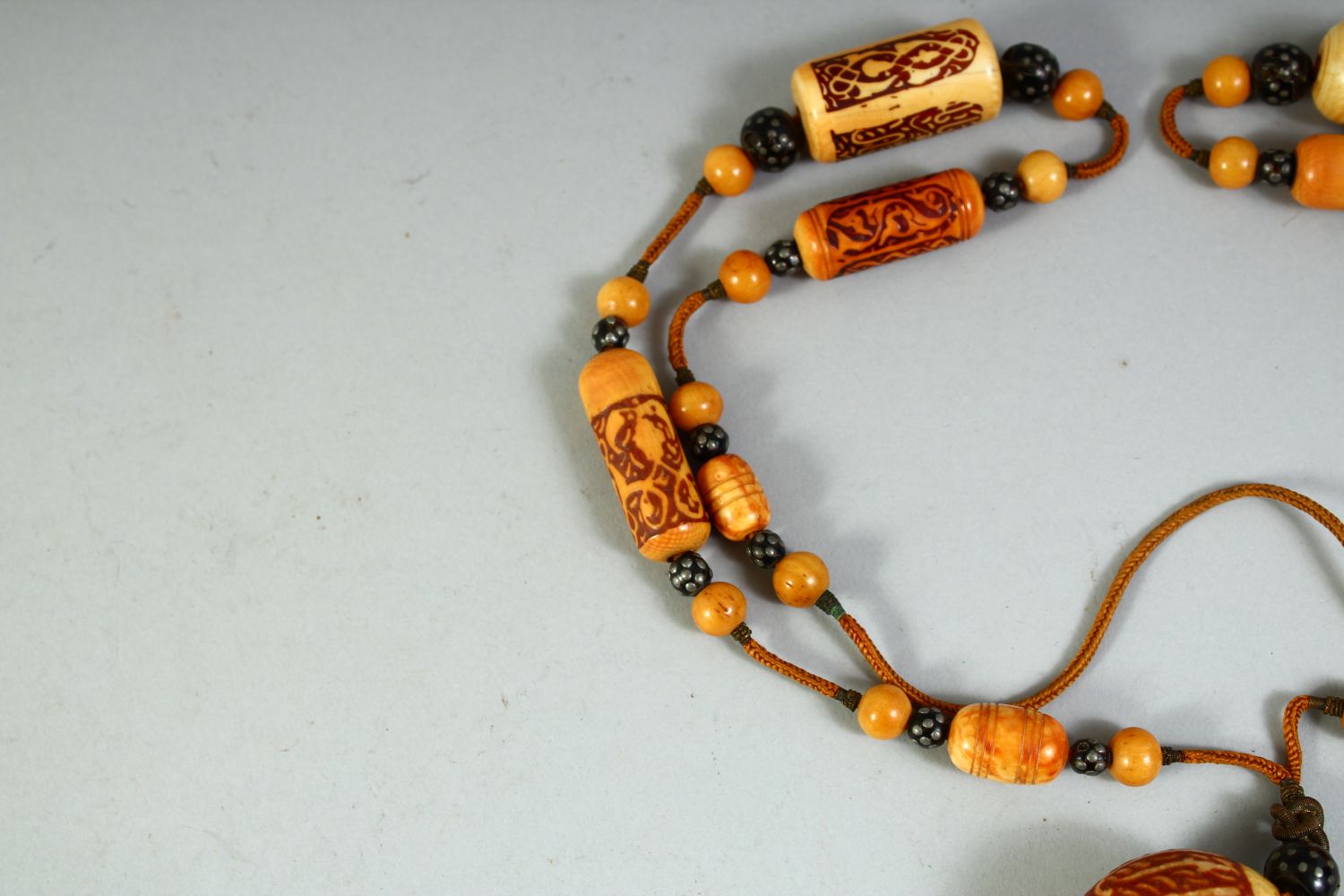 A RARE 18TH CENTURY OR EARLIER OTTOMAN IVORY, WALRUS AND BLACK CORAL BEADED NECKLACE. - Image 5 of 6