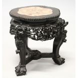 A SMALL CHINESE HARDWOOD AND MARBLE INSET STAND, with shaped top, carved and pierced frieze on three