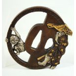 A JAPANESE BRONZE SHAKUDO TSUBA, of unusual form depicting a bearded figure and a demon, signed
