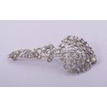 A 19TH CENTURY SRI LANKAN WHITE METAL TURBAN ORNAMENT, 7.5cm long.