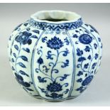 A CHINESE BLUE AND WHITE PORCELAIN PETAL SHAPE JAR, the ribbed body decorated with panels of flowers