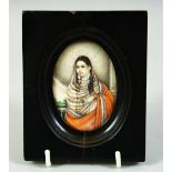AN INDIAN MINIATURE OVAL PORTRAIT OF A FEMALE FIGURE on ivory, in an ebonised wood frame and glazed,