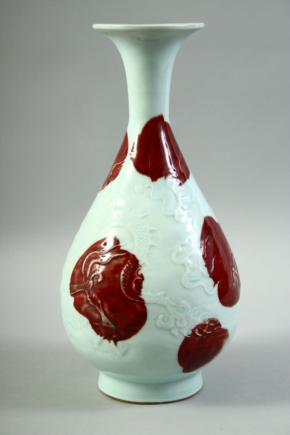 A CHINESE UNDER GLAZED RED AND WHITE DRAGON VASE, the body carved with a dragon and stylised flames, - Image 3 of 6