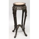 A CHINESE ROSEWOOD AND MARBLE INSET OCTAGONAL SHAPED VASE STAND, with bead carved top, pierced and