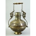 AN ISLAMIC OPENWORK METAL LANTERN / LAMP, with pierced floral decoration and handle, 38cm high